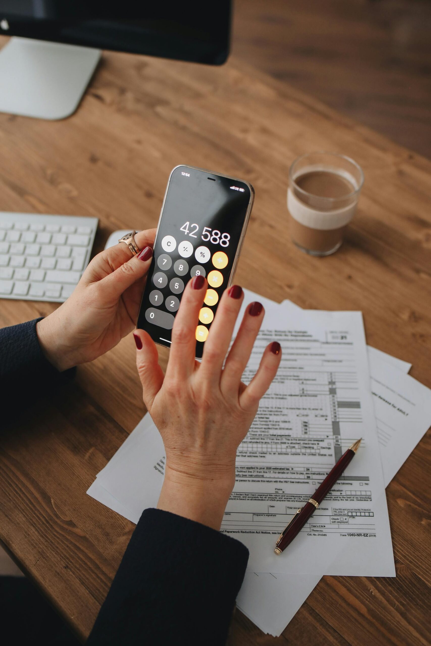 pexels-polina-tankilevitch-6927531 calculating deductions, smart phone