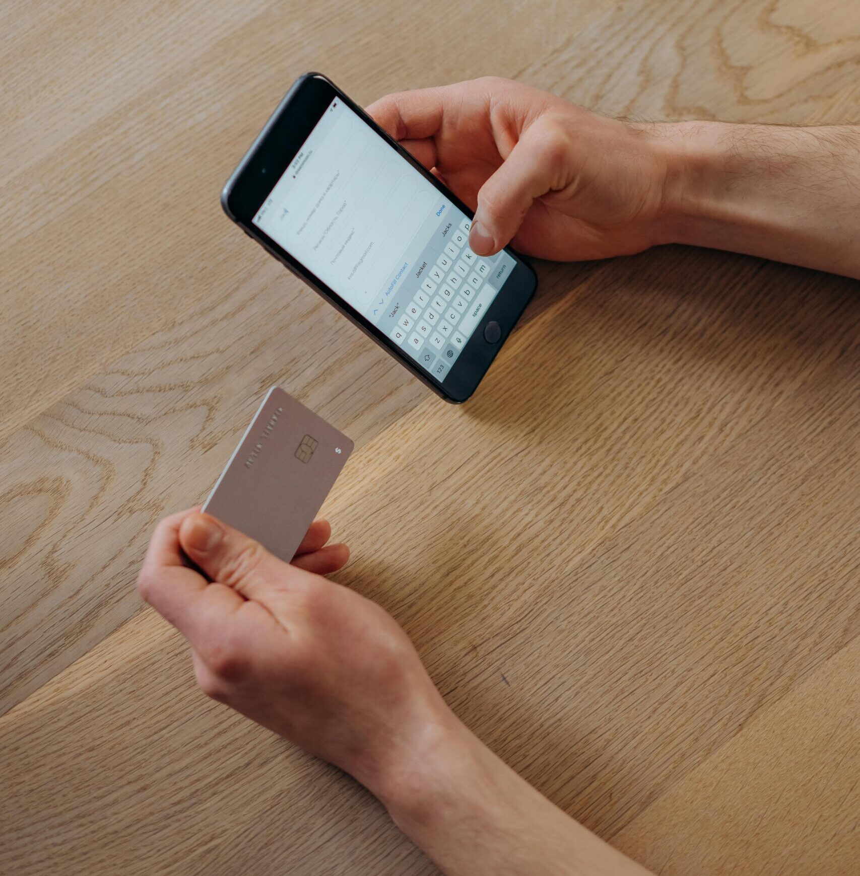 pexels-mikhail-nilov-6969810 Person entering credit card information on their cell phone